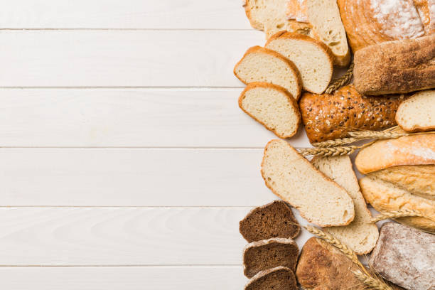 istock Homemade natural breads. Different kinds of fresh bread as background, top view with copy space 1447166426