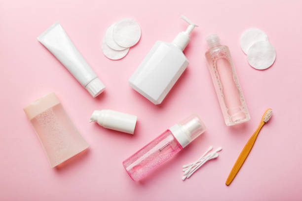 istock Micellar cleansing water and discs to remove cosmetics and cleanse the skin on colored background. Copy space top view 1447166457