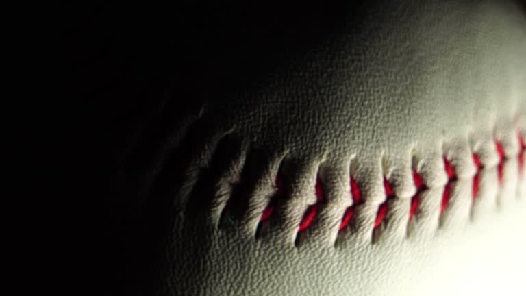 A baseball and equipment with a moving light follow