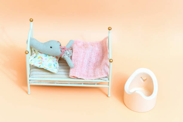 istock Little miniature bunny lies in bed. 1447168021