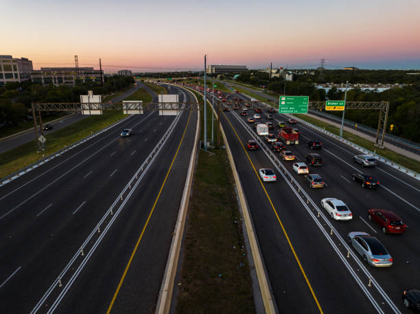 Transportation Highway aerial drone views above busy road ways and Toll Roads as morning traffic builds up and backs up on Mopac