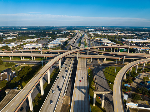 Cedar Park Texas Highway Interchange above huge long roadways and Toll Roads aerial drone view on a bright sunny day in Central Texas