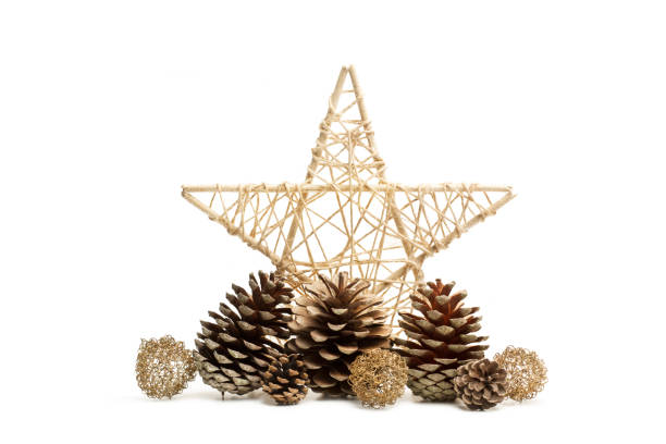 istock A star shape christmas ornament with pine cones on a white background 1447171182