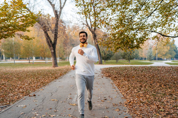 istock Young Man Running In The Public Park 1447174449
