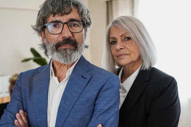 istock Senior business people looking serious on camera 1447175651