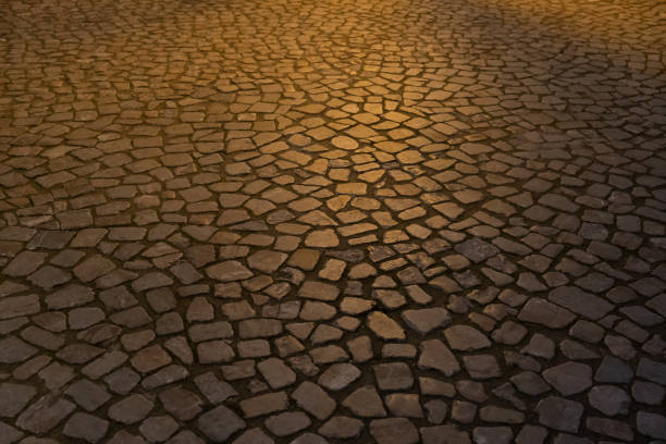 istock cobblestone road square at night in the light of lanterns 1447176518