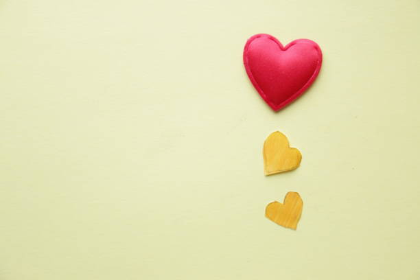istock Love heart. Creative valentine. Hearts on a yellow background. 1447176576