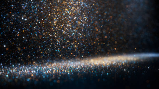 Blue And Gold Colored Glitter Particles Falling  - Christmas, Celebration, Snow, Winter stock photo