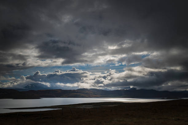 A dramatic, autumnal HDR image of Kyle of Tongue with Ben Loyal covered in low cloud in the background, Sutherland. Scotland.