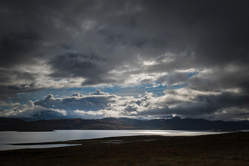 A dramatic, autumnal HDR image of Kyle of Tongue with Ben Loyal covered in low cloud in the background, Sutherland. Scotland.