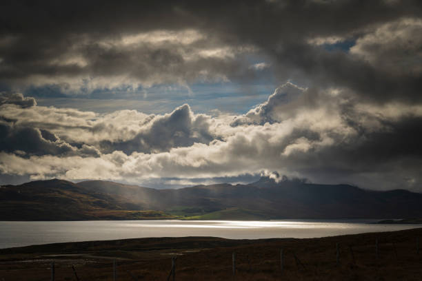 A dramatic, autumnal HDR image of Kyle of Tongue with Ben Loyal covered in low cloud in the background, Sutherland. Scotland.