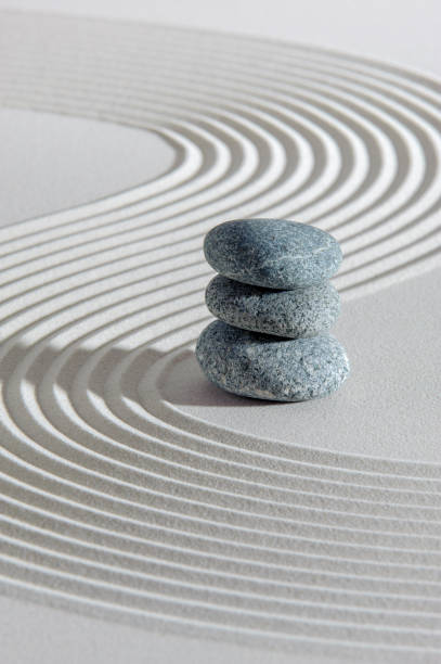 textured sand and stone in japanese zen garden - rock garden imagens e fotografias de stock