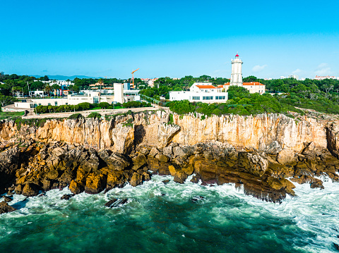 Drone view of the rocks beside the ocean in Cascais, Portugal