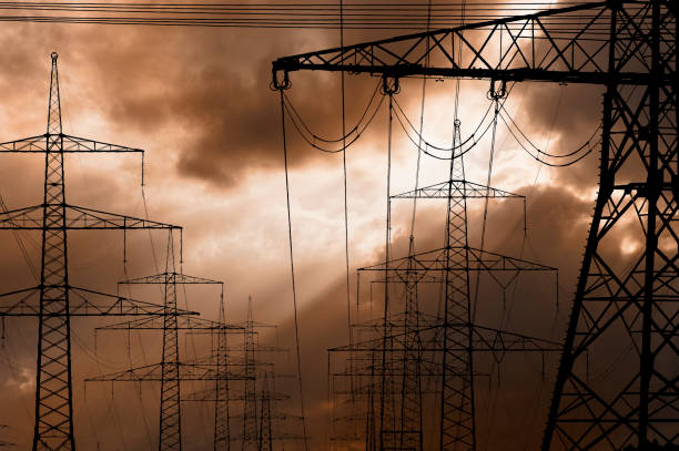 istock pylons and high voltage cable for electricity and energy 1447179106