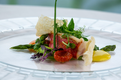 Dish of asparagus egg and tomato