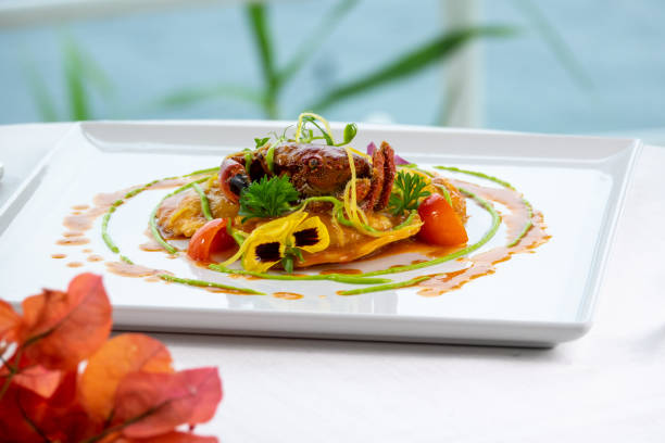 Dish of ravioli with whole crab