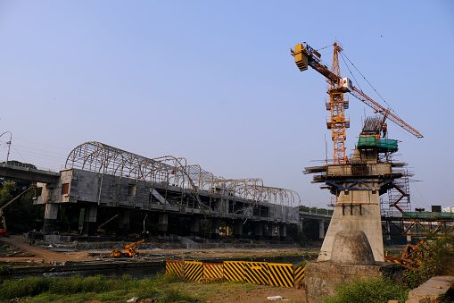 Pune, India - 06 December 2022, Construction of Pune metro bridge for Pune Metro Rail Project, erection of steel segments.