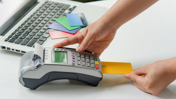 istock Credit card payment with EDC machine or credit card terminal. 1447183936