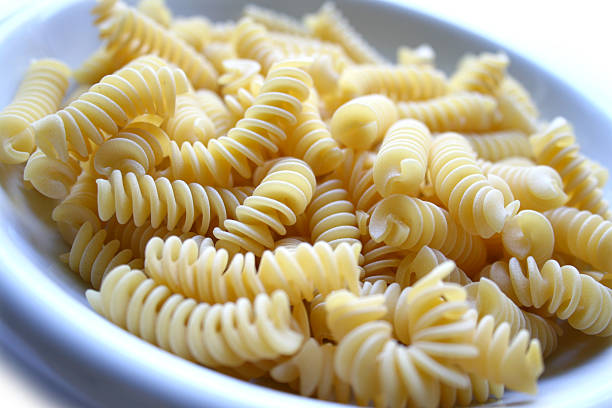 dish of pasta fusilli stock photo