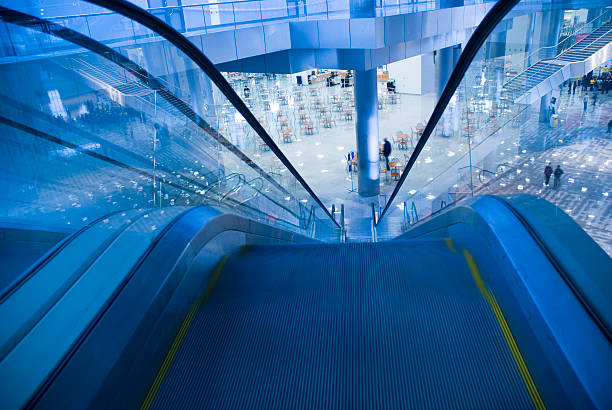 istock moving escalator in the office hall 144718423