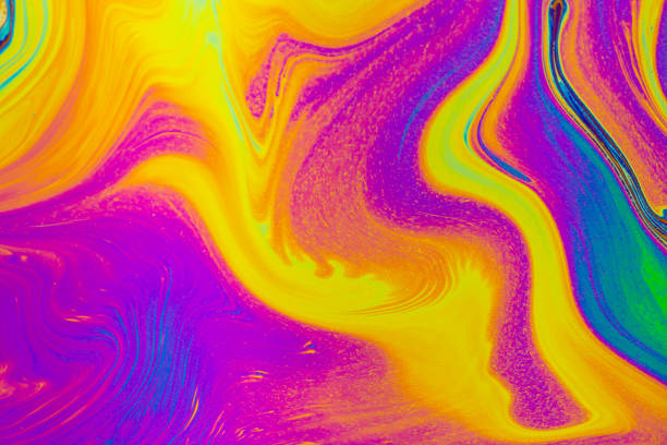 istock Rainbow colors. Psychedelic multi colored patterns background. Photo macro shot of soap bubbles 1447184696