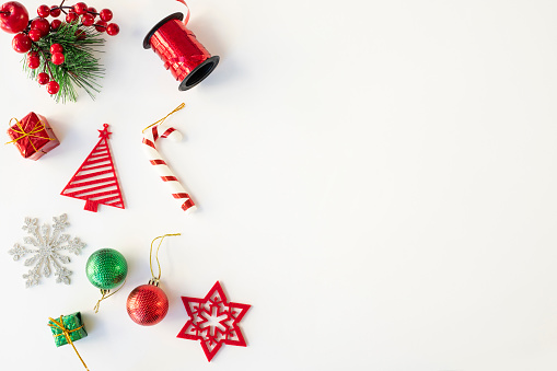 Christmas composition. Christmas red and silver decorations on white background. Flat lay, top view, copy space