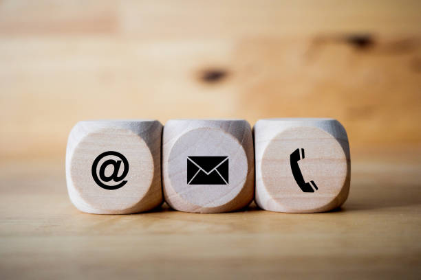 istock contact us icon (phone, email, mail ) on wood cube, customer service and support call center concept 1447185777