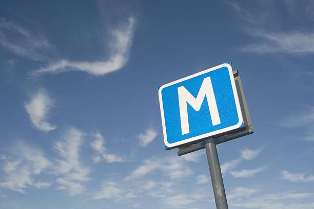 M-sign with blue sky stock photo