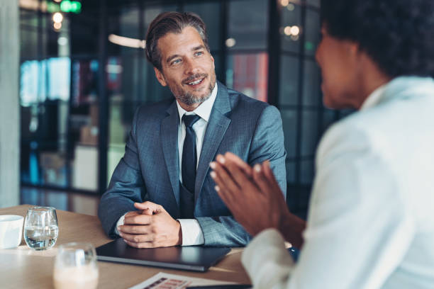 istock Business partners talking in the office 1447188471