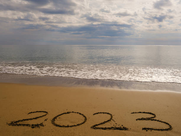 istock 2023 numbers handwritten on the sand 1447188541