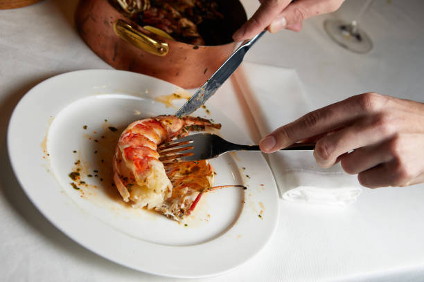 istock butchering a large shrimp during dinner 1447189991
