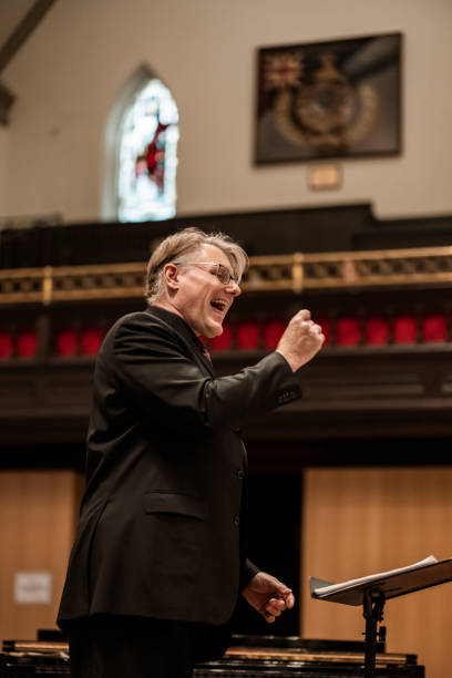 istock Church Choir Conductor during Concert performance 1447190050
