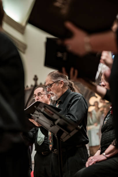 istock Men singers in Church Choir during performance at Concert 1447190408