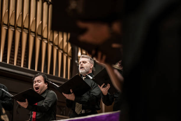 istock Men singers in Church Choir during performance at Concert 1447190409