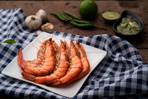 Grilled pacific white shrimp(Litopenaeus vannamei) with seafood sauce.