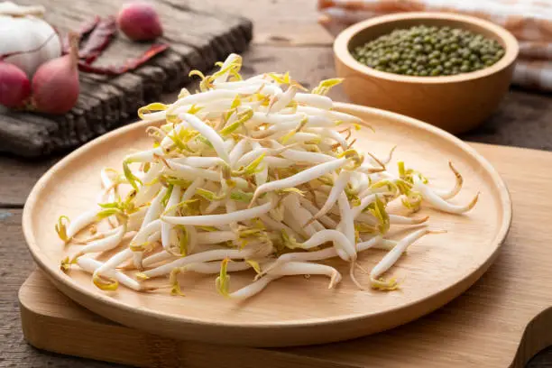 Fresh beansprout on wooden plate