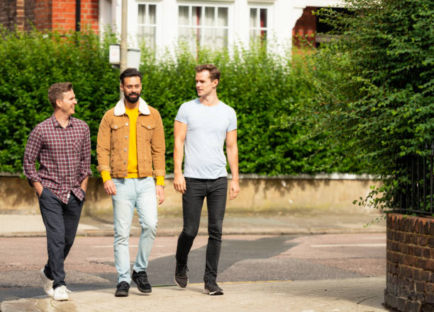 istock Friends chatting on the street 1447193481