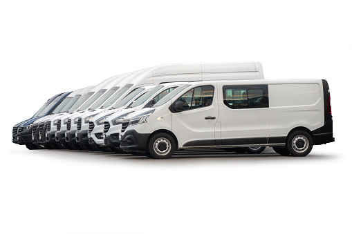 White vans in a row on white background