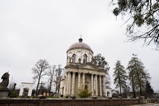 Baroque Roman Catholic church of St. Joseph mid 18th century. Latin on main facade - TO THE GLORY OF OUR LORD GOD, Pidhirtsi, Lviv Oblast, Ukraine.