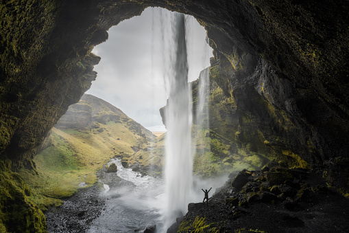 A cave behind one of the more incredible waterfall in iceland