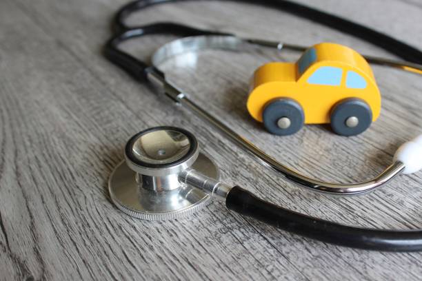 istock Toy car and stethoscope. 1447196142