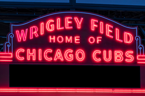Chicago - Circa May 2021: Wrigley Field Home of Chicago Cubs in red neon lights with copy space. Wrigley Field has been home to the Cubs since 1916.