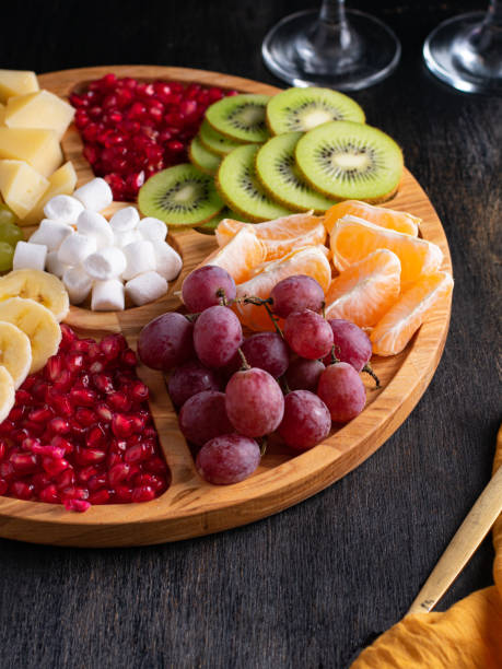 istock Appetizers boards with assorted sweets and fruits . Dessert Charcuterie board. copy space. Vertical 1447198727