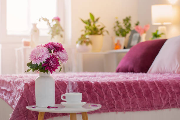 istock hot drink in white cup on background pink and white bedroom 1447200647