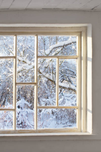istock old window with snowy beautiful landscape 1447200682