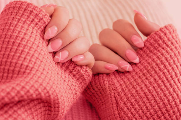 istock womans hands with manicure with  knitted blanket 1447200705