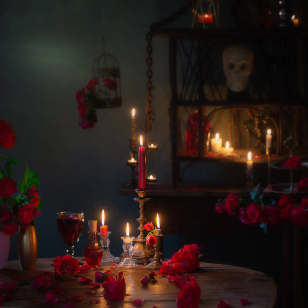 istock magic potion with red roses and burning candles in dark room 1447200746
