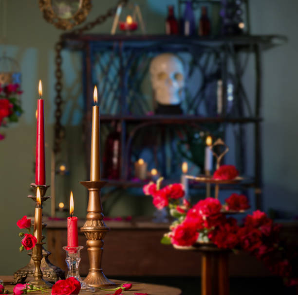 istock magic potion with red roses and burning candles in dark room 1447200758