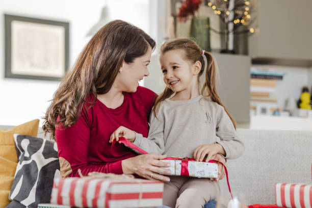 istock Excitement of opening Christmas presents 1447202696