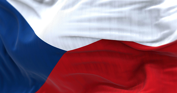 Close-up view of the Czech Republic national flag waving in the wind. Czech republic is a landlocked country in Central Europe. Fabric textured background. Selective focus. 3d illustration